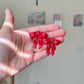 Red Bow Statement Studs